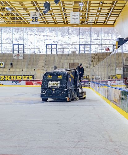 Dasher boards and an ice resurfacer